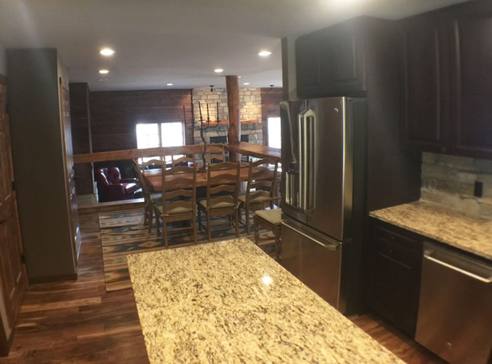 Elevated dining area adjacent kitchen and overlooking living room.  
