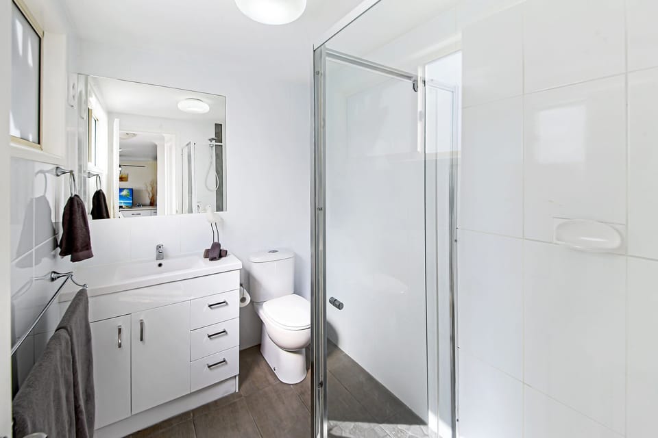 Bathroom with toilet and step free shower. We have separate 2nd toilet 