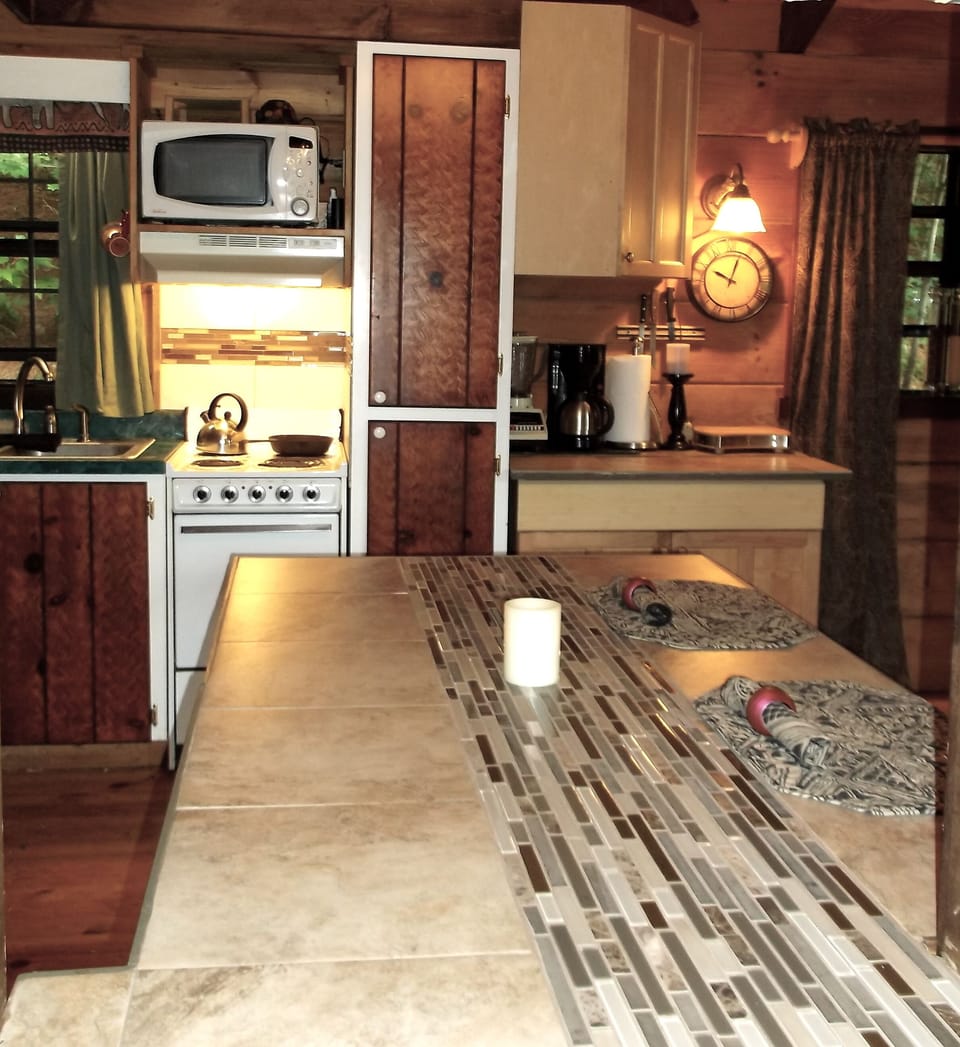 From entry-rm is pass-thru opening to kitchenette w/sm appliances to prep meals