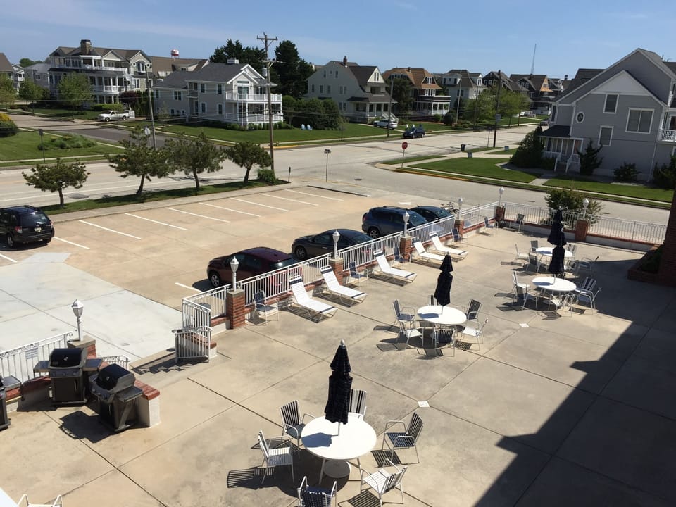 One of two patios with outdoor seating and gas grills for your enjoyment