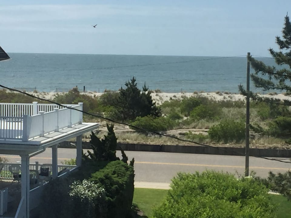 Beautiful ocean view with beach is just steps away!