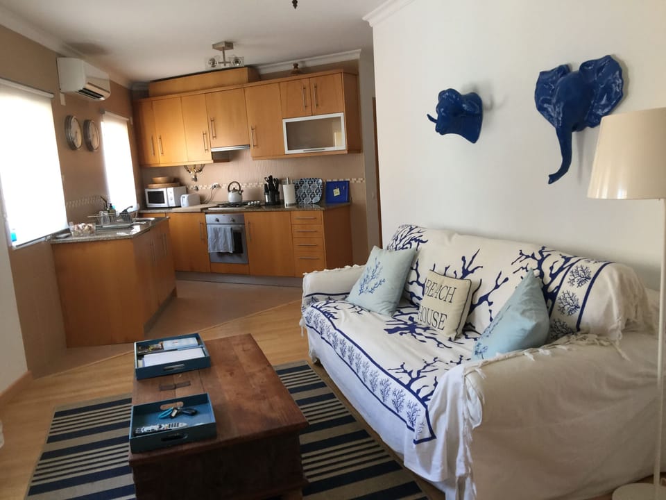 Part of the living room, around the corner there is a table to eat