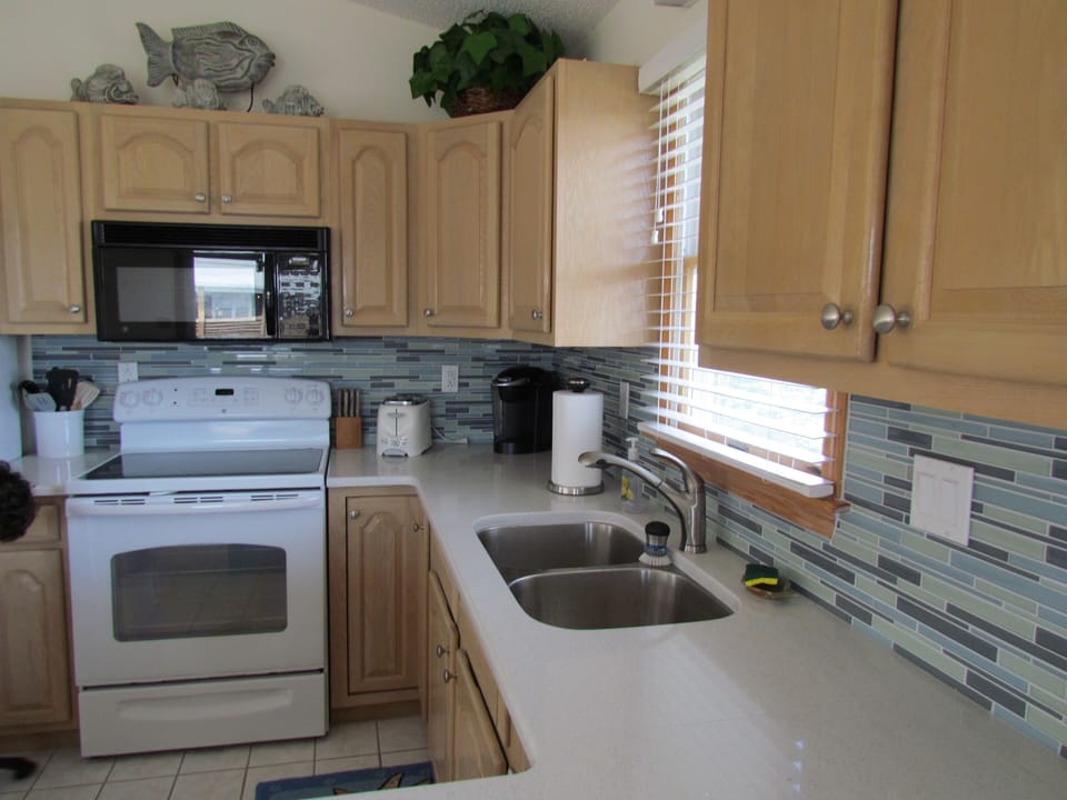 Updated kitchen with quartz countertops.