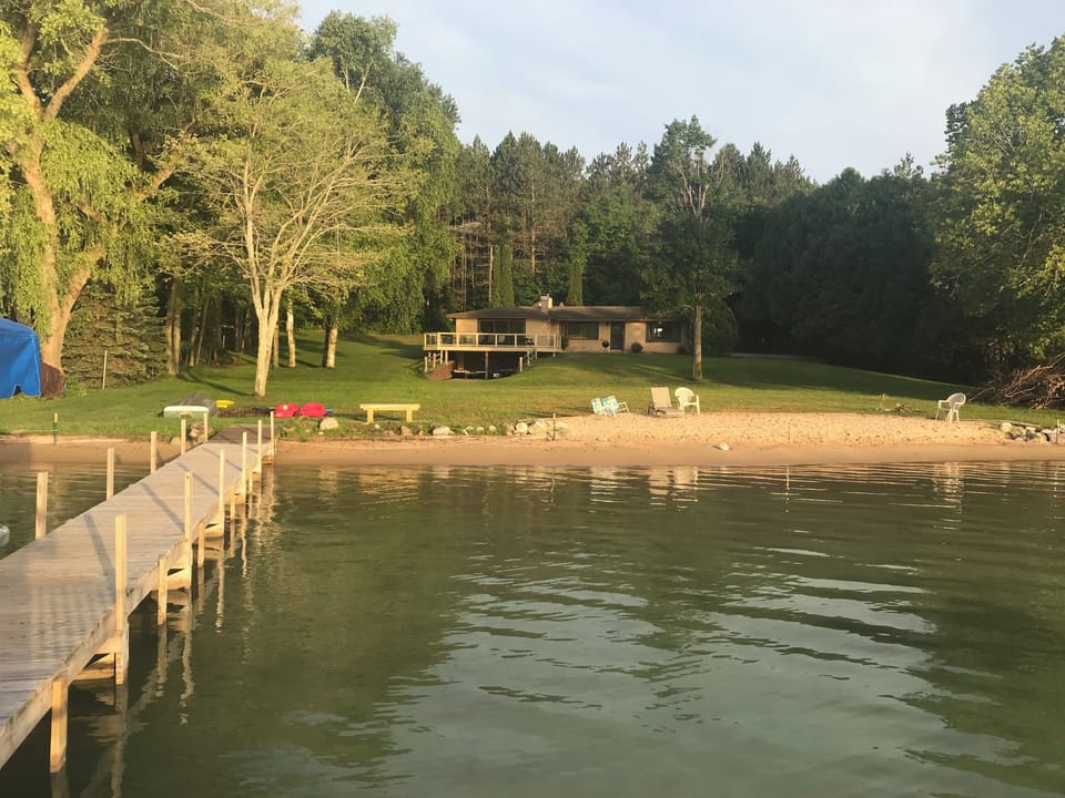 160 ft. of private frontage on beautiful Walloon Lake, large yard for activities