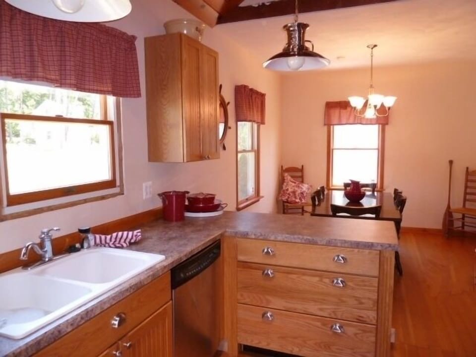 Custom crafted kitchen has separate dining area.
