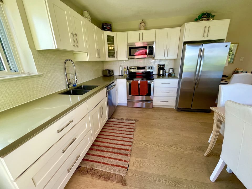 view from the entrance to the kitchen. Stainless steel appliances. 