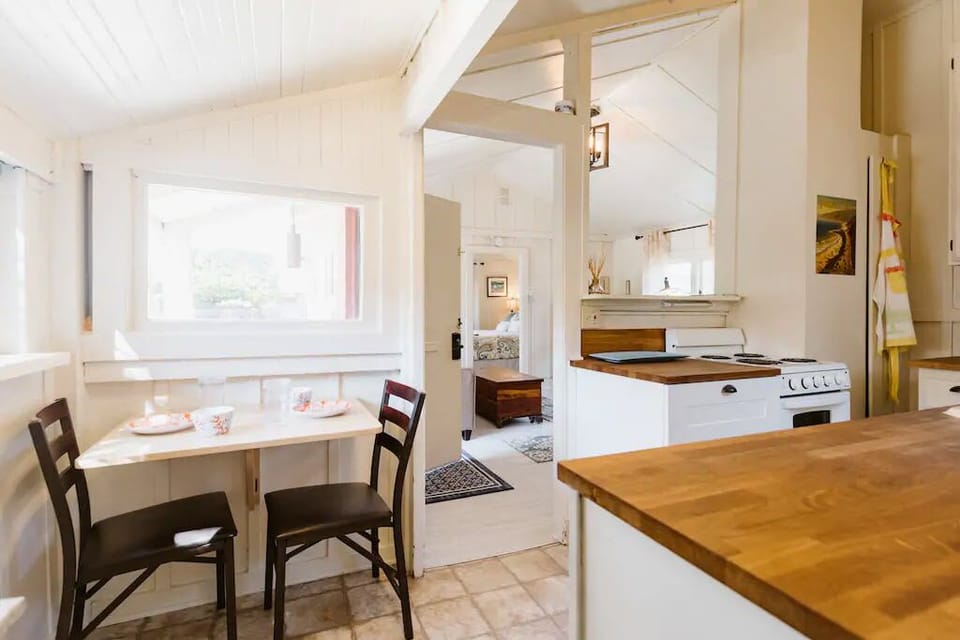 Small dining area and a Victorian fold-out table that seats 6.