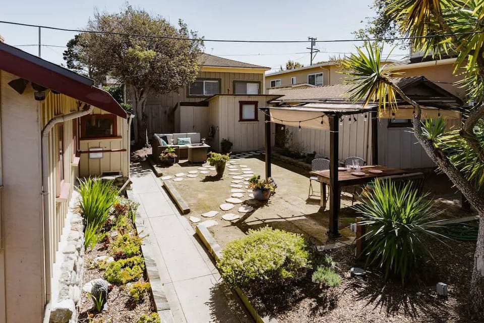 Main cottage on left + carriage house on right...in outdoor living courtyard.