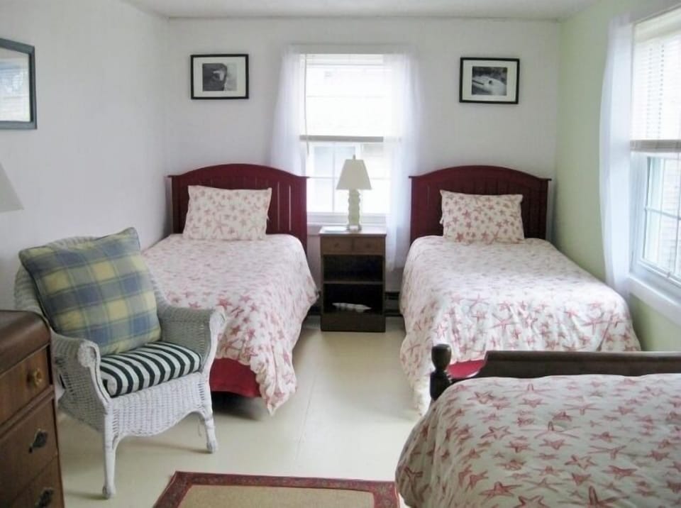 Three singles beds finish the front bedroom.