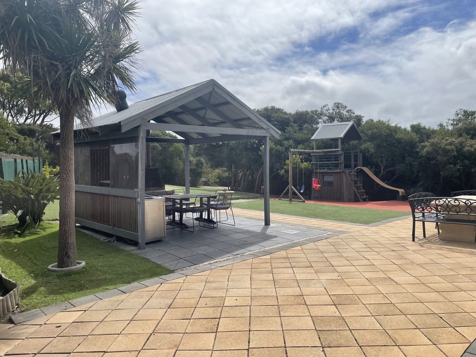 BBQ area with seating and Playground