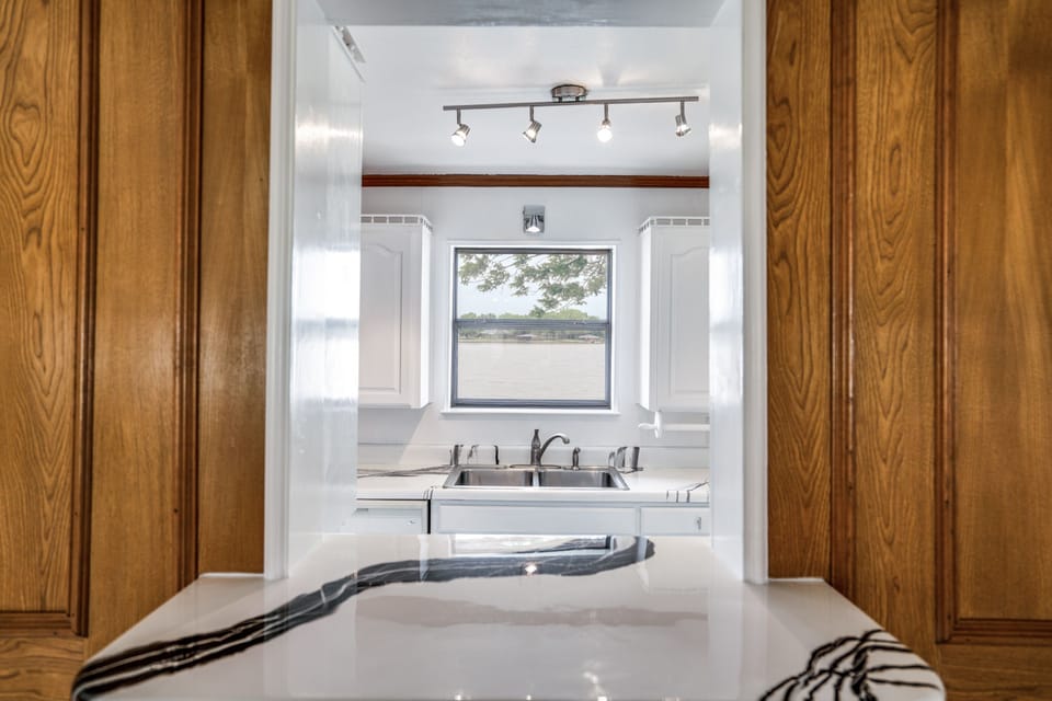 Relax with a drink at the bar while you visit with the cook in the kitchen.