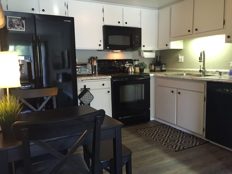 Upgraded kitchen w/side by side frig, speed bake, glass top stove & microwave.