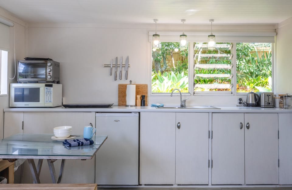 Benchtop pizza oven, microwave, benchtop hobs, kettle, toaster, tea/coffee.
