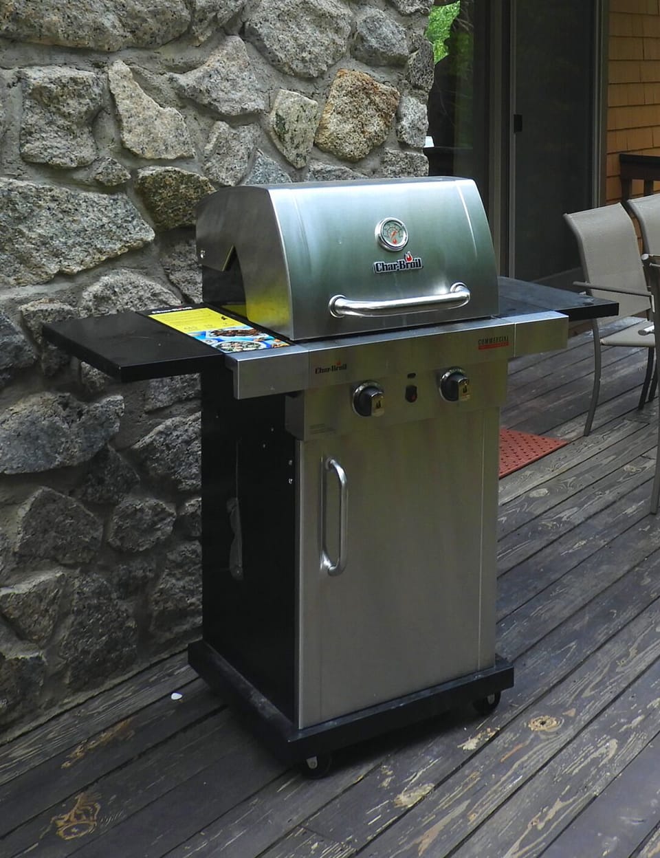 Similar grill pictured, with outdoor fire pit.