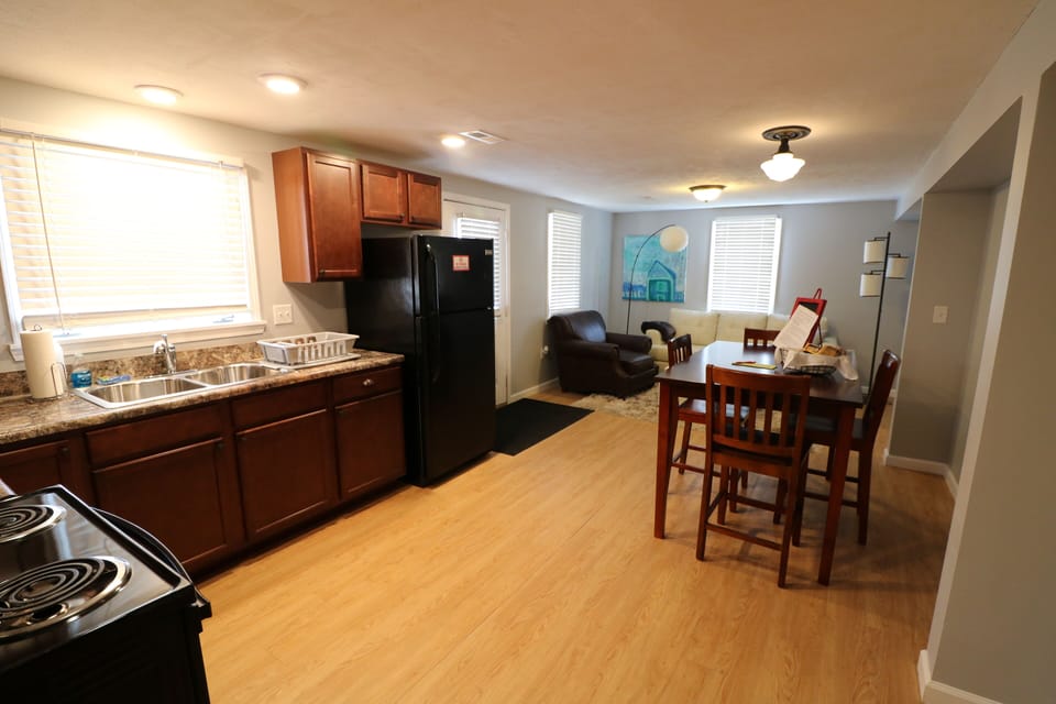 Open kitchen, dining, living area.