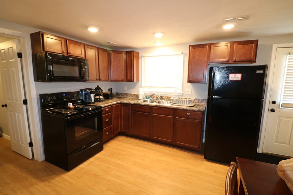 Kitchen stocked with necessities for cooking.