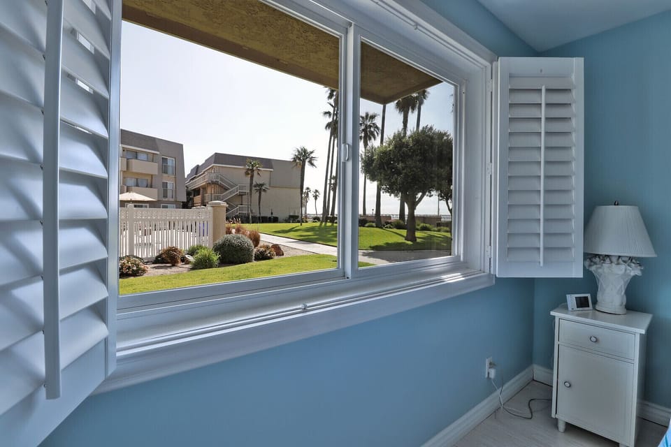 see the pool, spa, white caps, and pier from your bedroom window