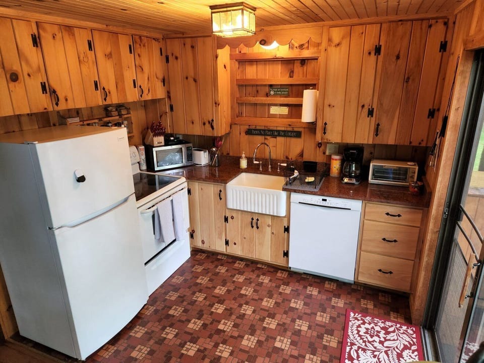 Kitchen area, with farm sink, dishwasher, microwave, toaster, coffee maker, etc.