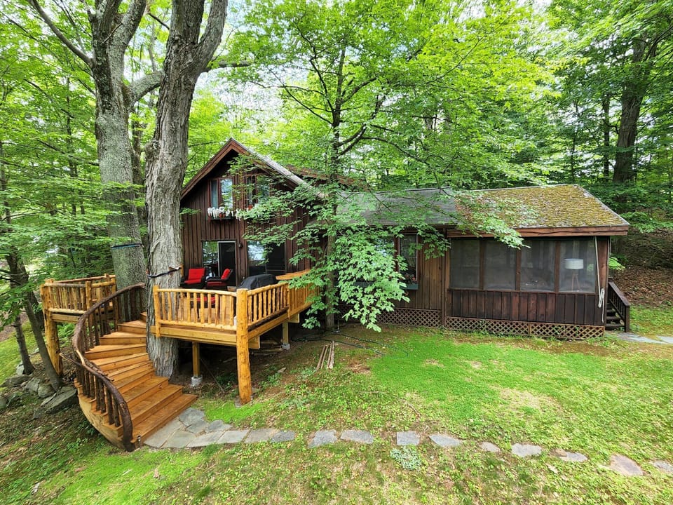 Screened in porch on right, Tree Deck on left...opens into LR/Kitchen area.