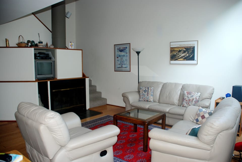 Living Room with Stairway to Second Floor and Loft