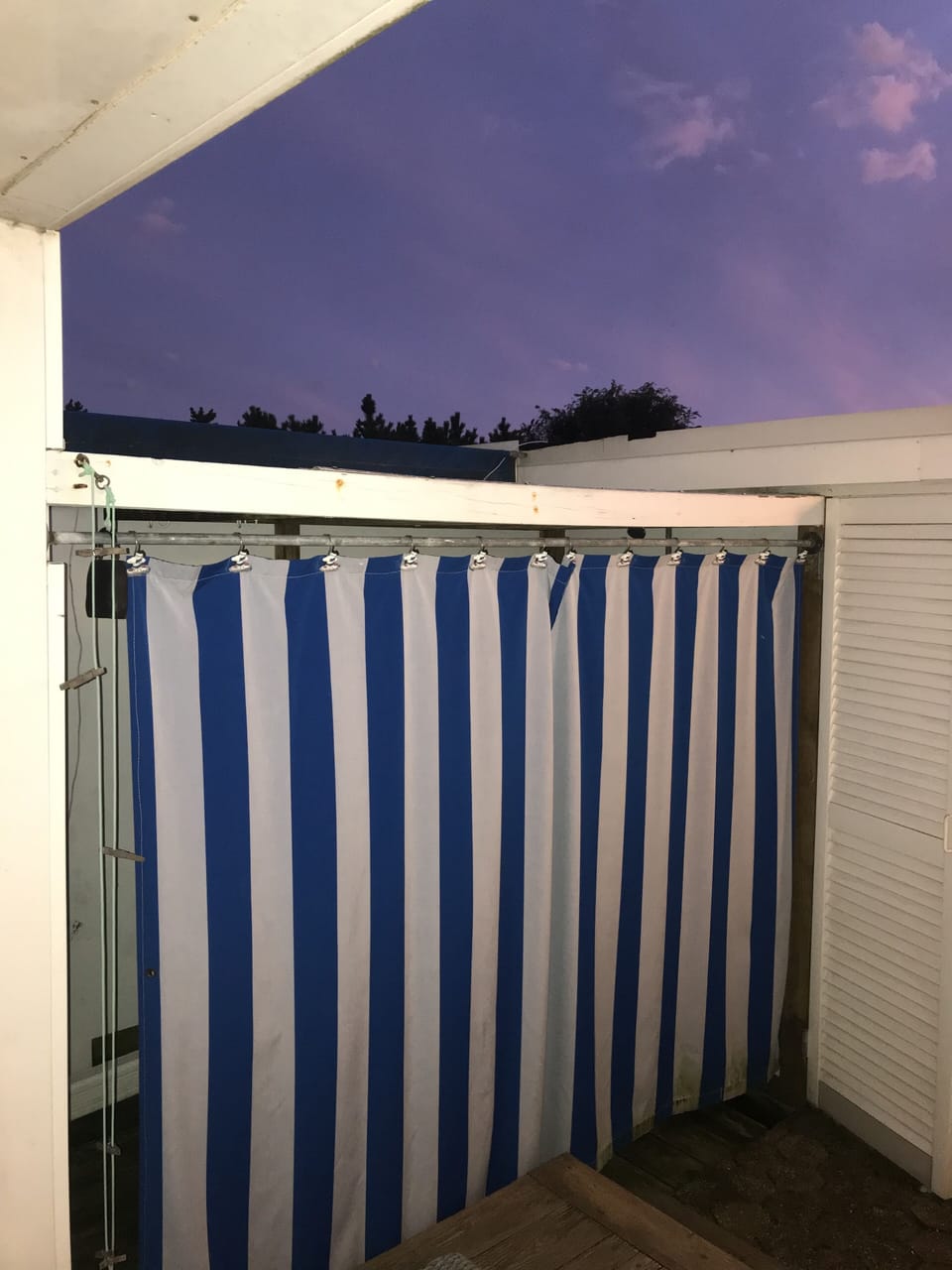 Outdoor shower, complete with shampoo, conditioner, and body wash