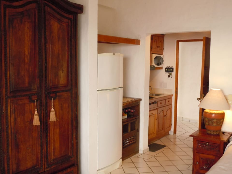 Refrigerator & bar; overhead suitcase storage, 10 gallon bottled water included