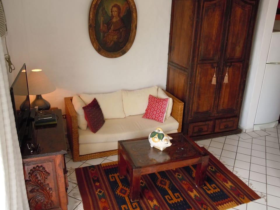 Relax & unwind in the unit's well appointed lounge area & large clothes armoire
