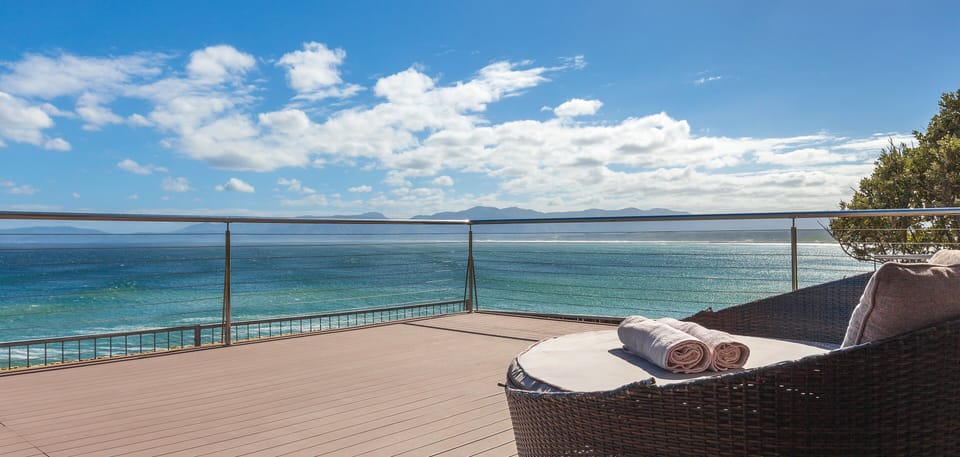 deck with panoramic ocean view and comfortable loungers