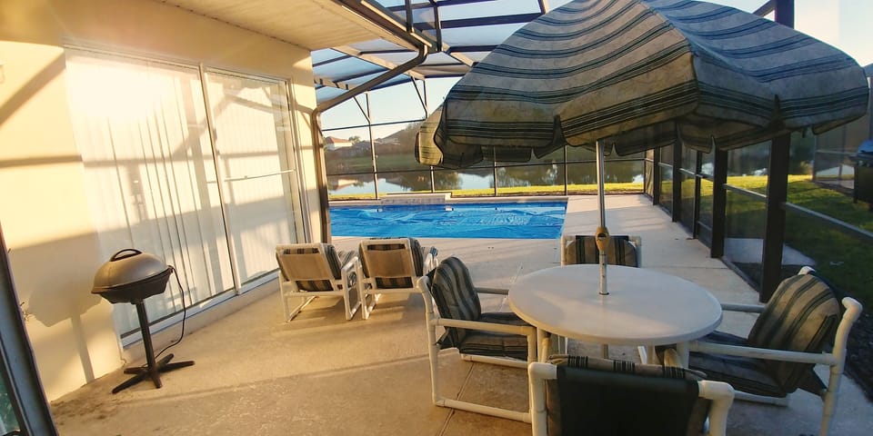 Patio set, BBQ, lounge chairs, solar cover, and safe fence