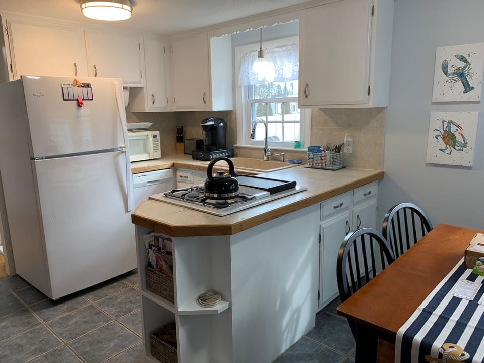 Fully equipped kitchen with inside and outside dishes, Keurig brewer, pots, pans