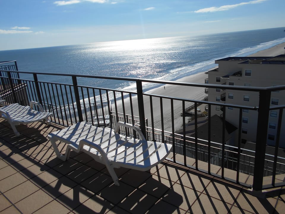 Private 1000 Sq foot Wraparound Oceanfront Sun Deck with New Tile and Awnings