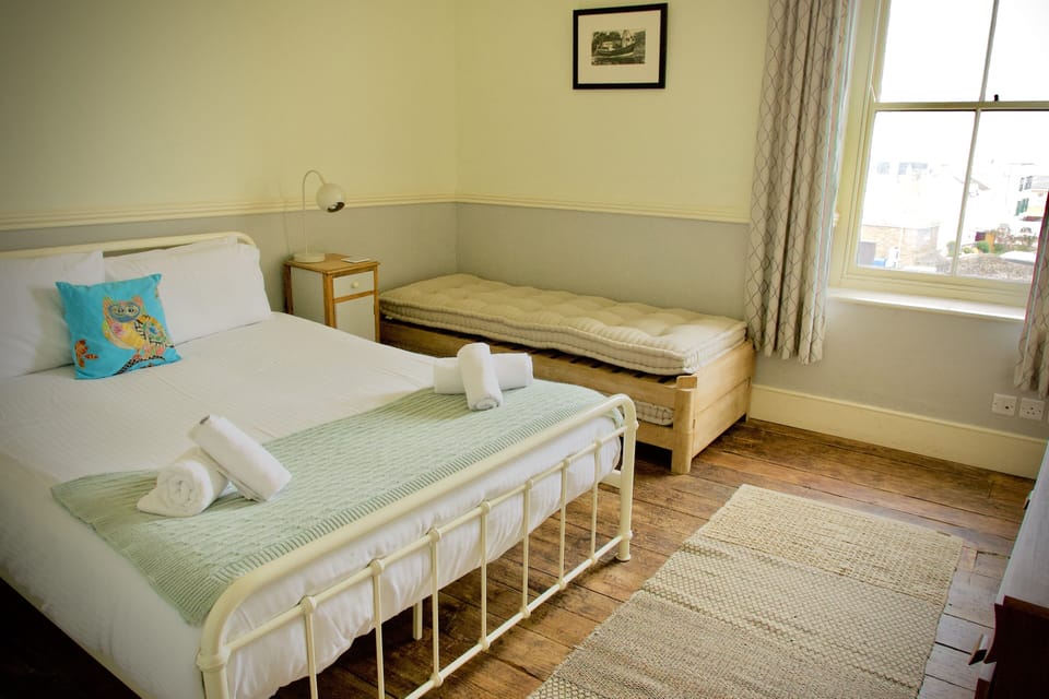 Bedroom 1. Double bed with built in wardrobe and fantastic views of the harbour.