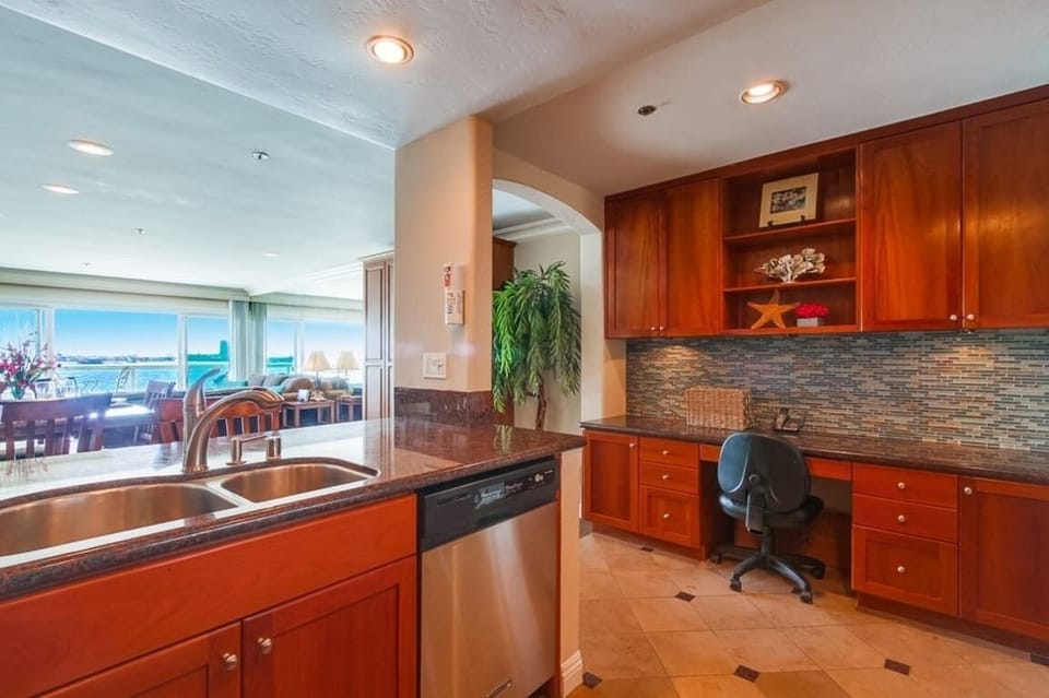 "Work from Home" with the designated desk adjacent to the kitchen with ample cabinet and drawer space. And how about that view!