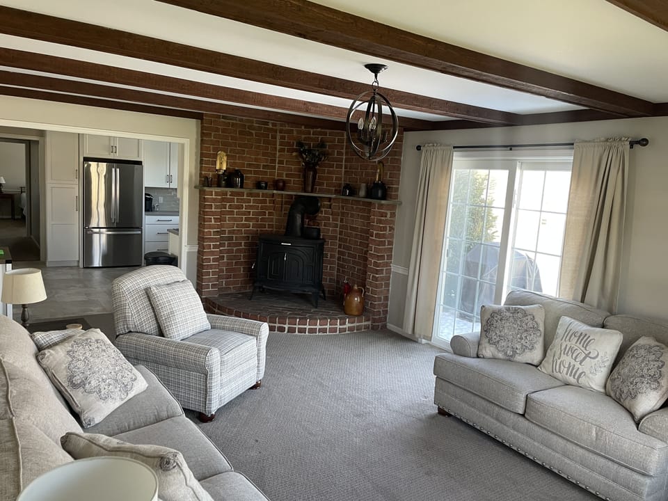 Family room with plenty of seating and TV.