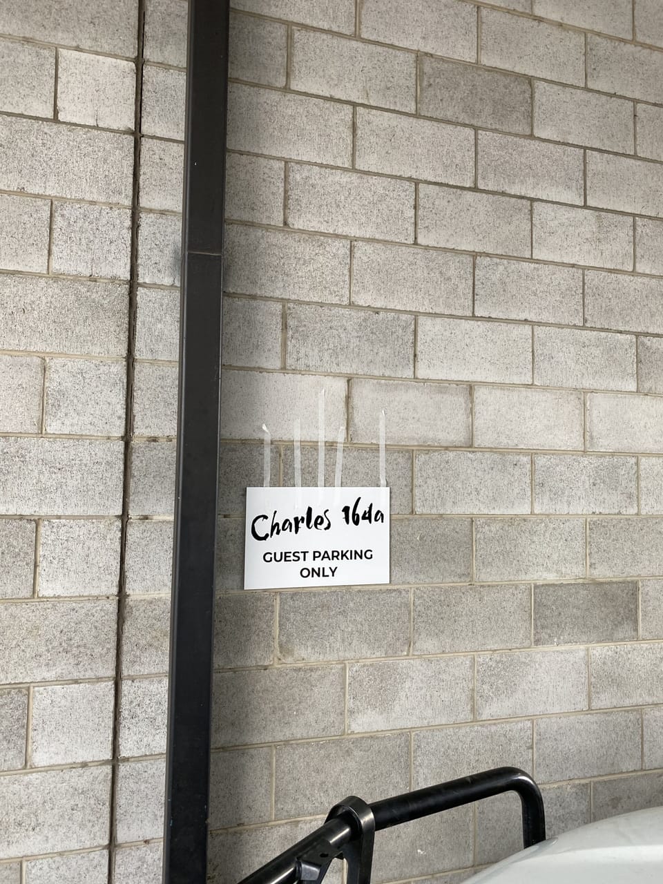 Sign on the wall of parking space No# 14
Situated in the undercover lane way ...