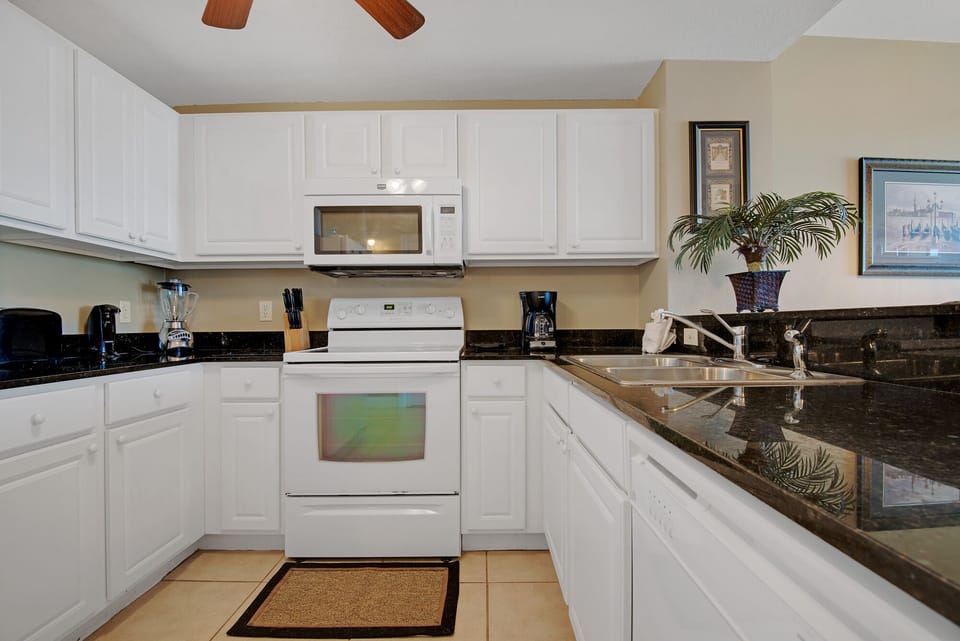 fully equipped kitchen; granite counters; tile floors