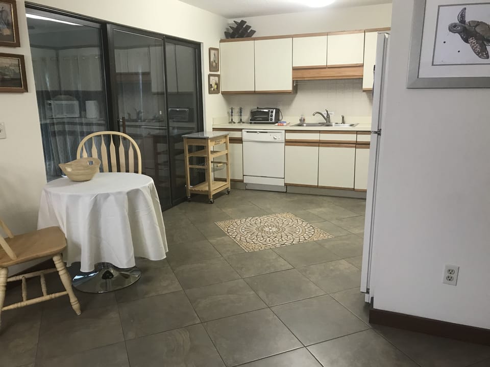 Kitchen with bistro table and 2 chairs (third in the garage if needed)