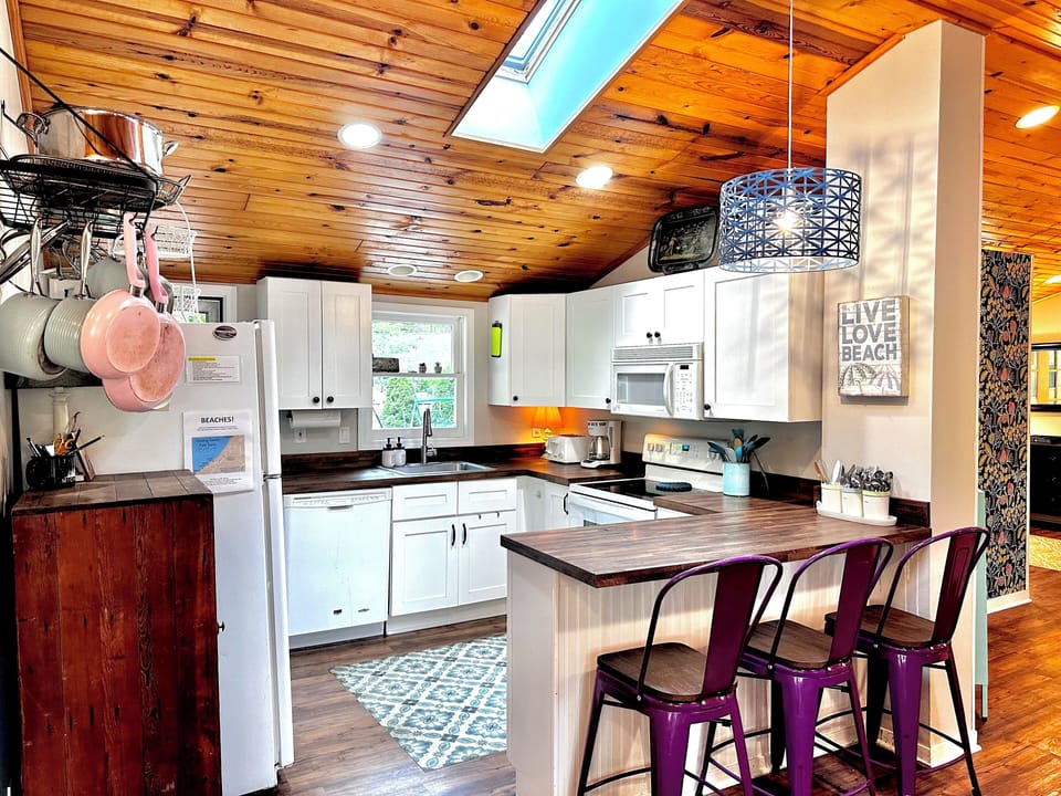 fully stocked open kitchen with skylights.  Walk in pantry also.