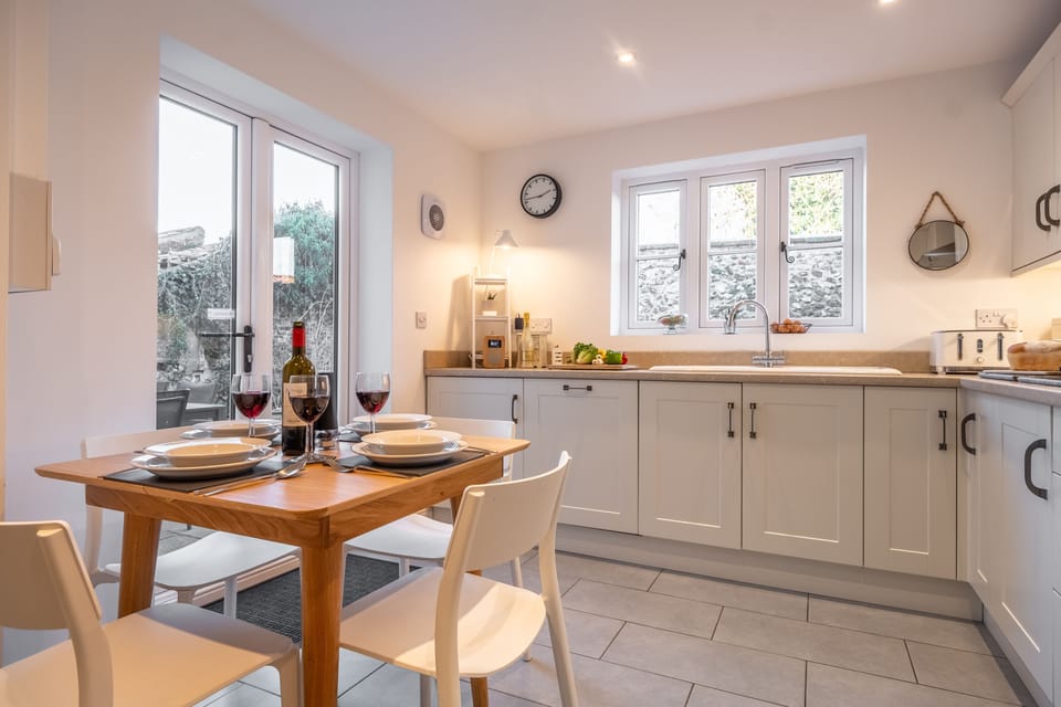 Ground floor: Kitchen/ dining room with french doors to the courtyard garden