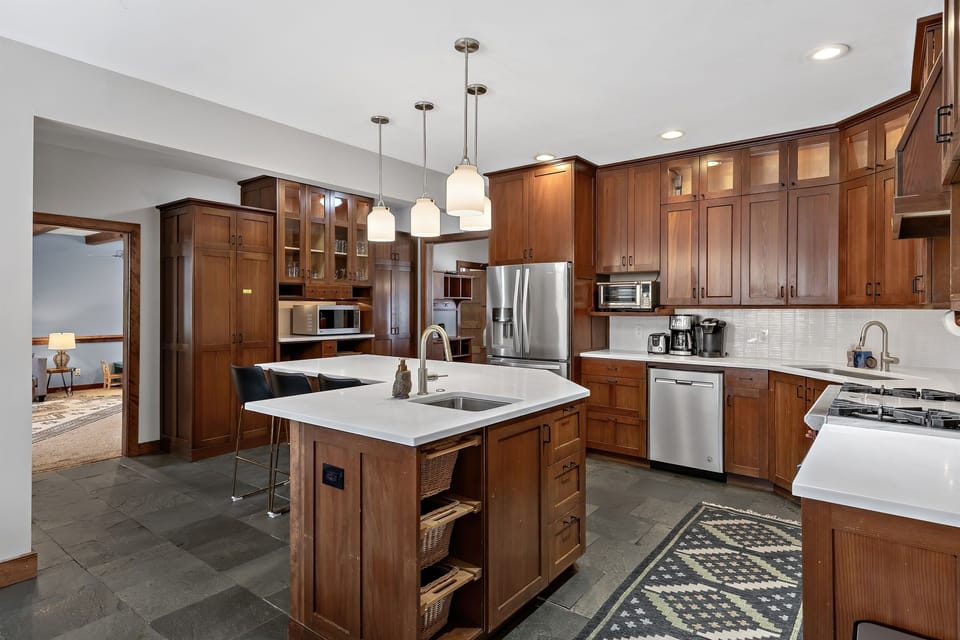 Huge kitchen with 2 sinks and plenty of counter space for cooking/serving for large groups!