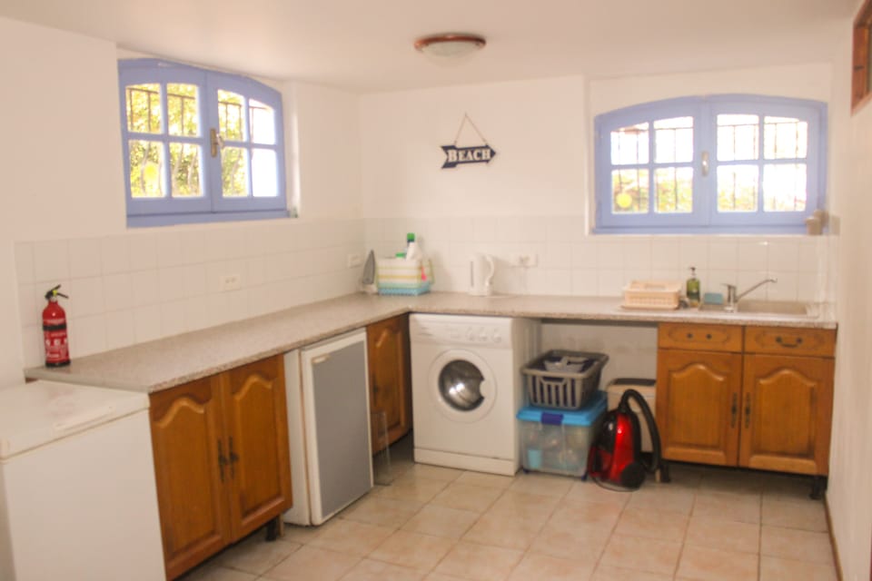 Second kitchen / utility with chest freezer, second fridge, washing machine