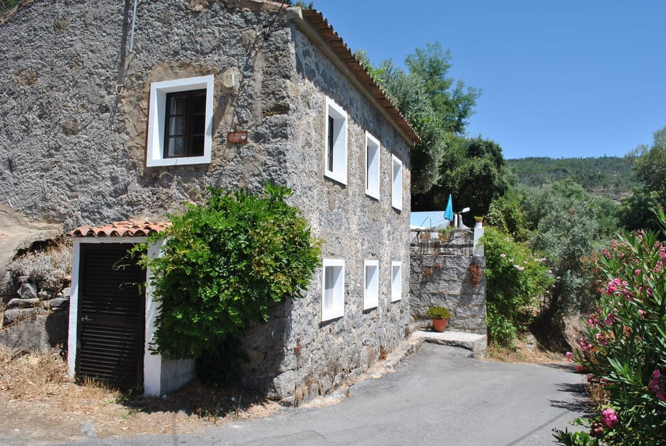 Stonehouse showing, terrace & wooded surroundings.