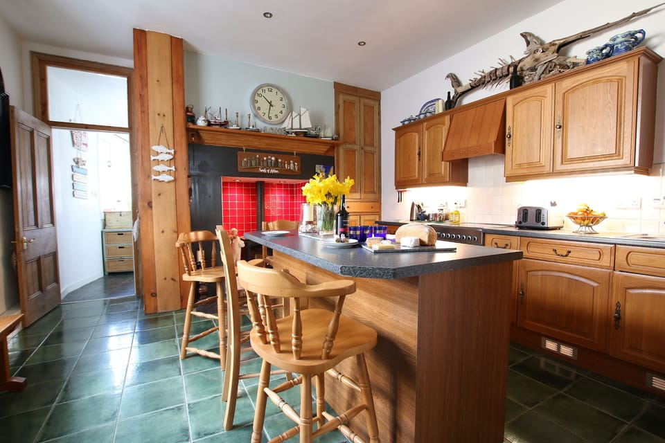 kitchen with wood burning stove and utility room