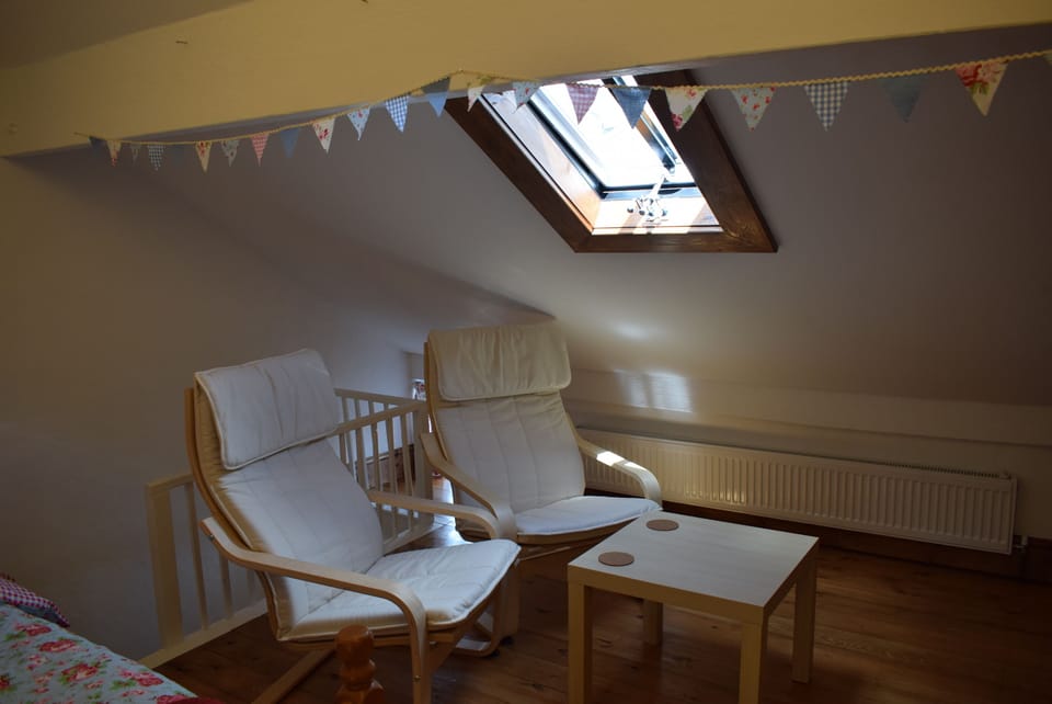 Sit back and relax in the spacious attic room