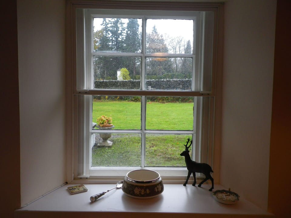 Looking out on the garden. Note the Pepperpot Lighthouse behind the canal wall.