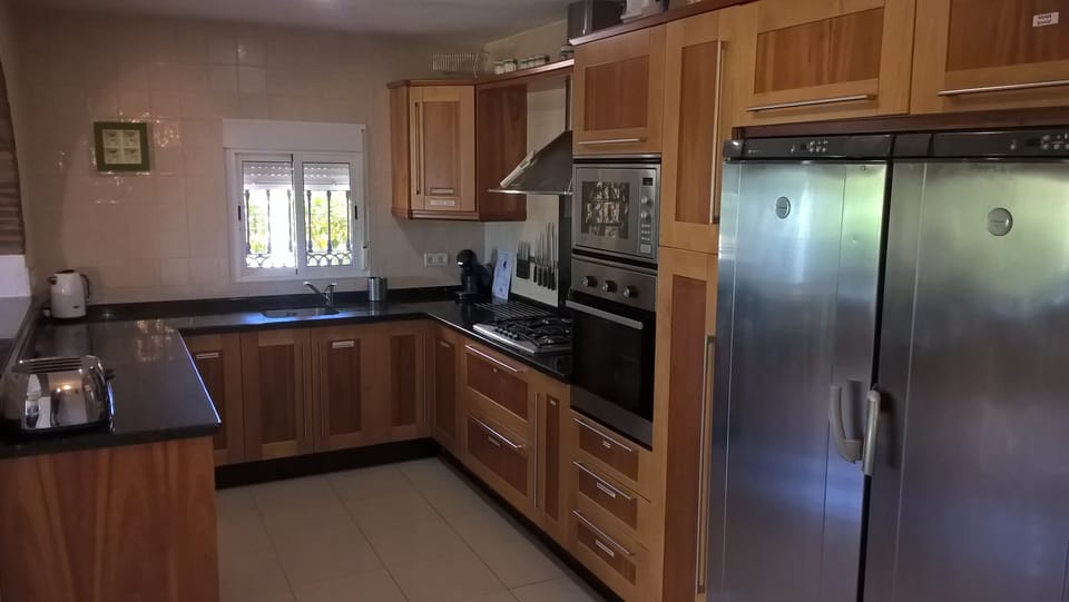 Villa kitchen, full sized fridge and freezer, gas hob, microwave, oven etc...