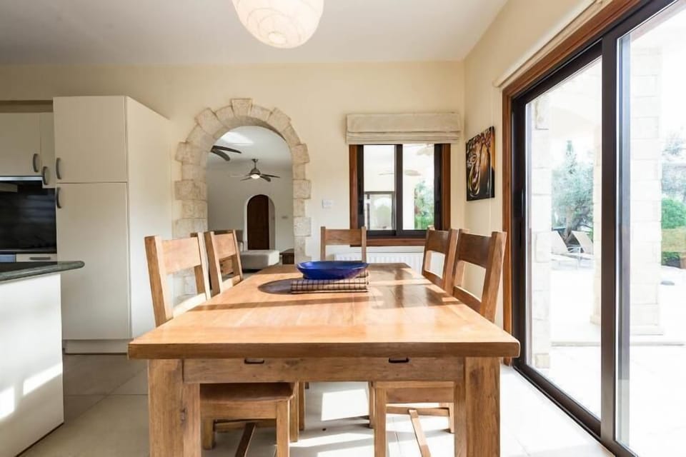 A stone archway leads into the Lounge area