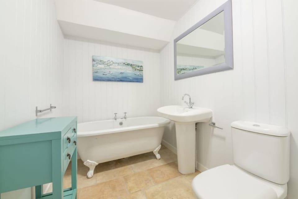 Family bathroom with free standing roll top bath and separate shower cubicle