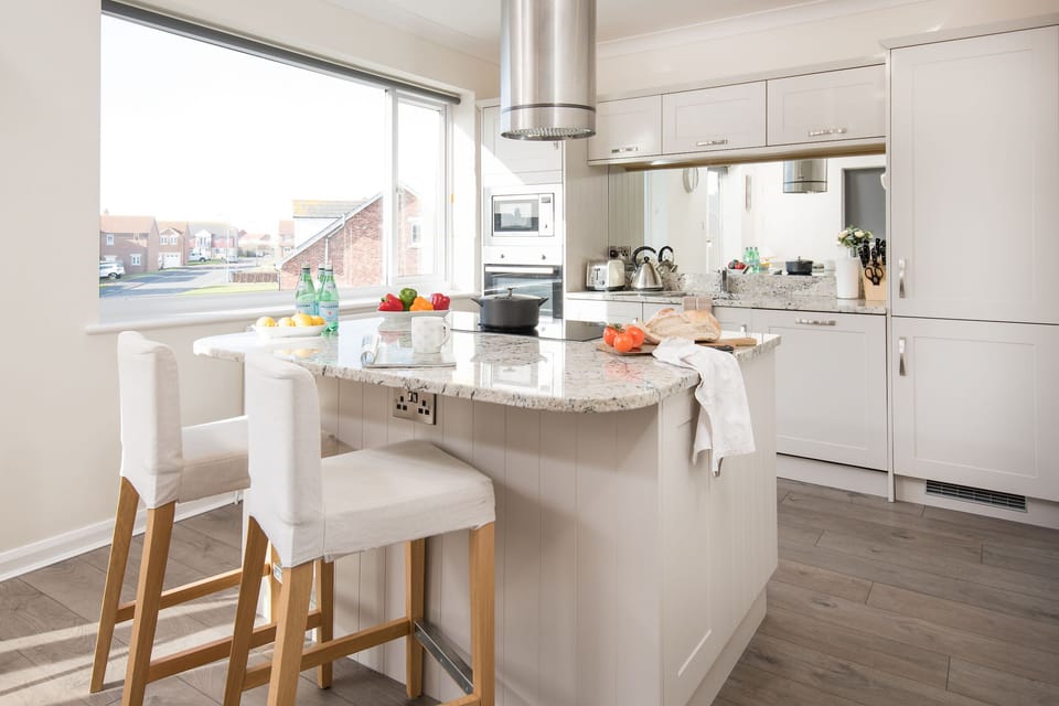 Kitchen with granite work surfaces