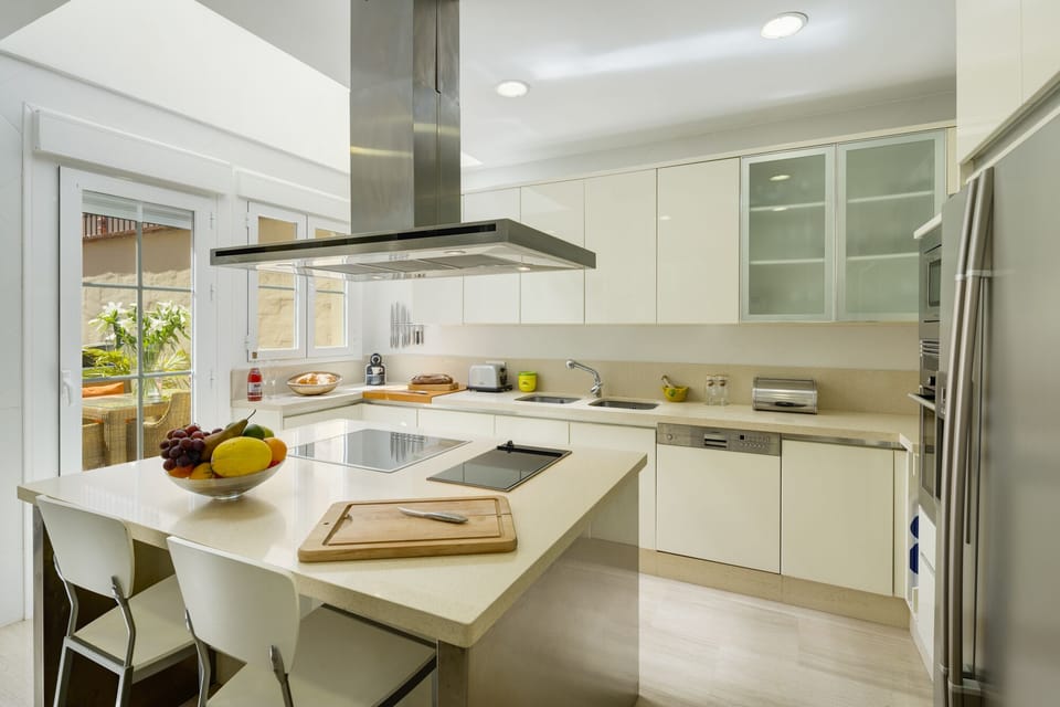well stocked modern kitchen, patio doors leading to breakfast terrace.